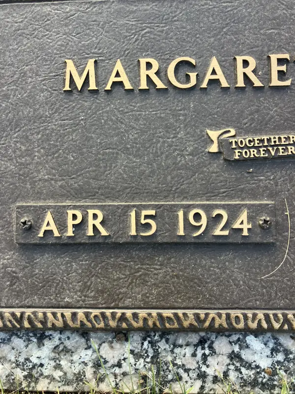 A custom date plate affixed to an existing granite monument by LetterNstone
